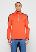 Helles Orange, langärmeliges Halb-Zip-Oberteil mit kontrastierenden schwarzen und weißen Einsätzen; strukturierter Stoff und figurbetontes Design.