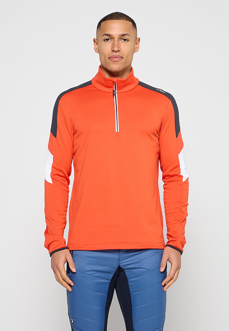 Helles Orange, langärmeliges Halb-Zip-Oberteil mit kontrastierenden schwarzen und weißen Einsätzen; strukturierter Stoff und figurbetontes Design.