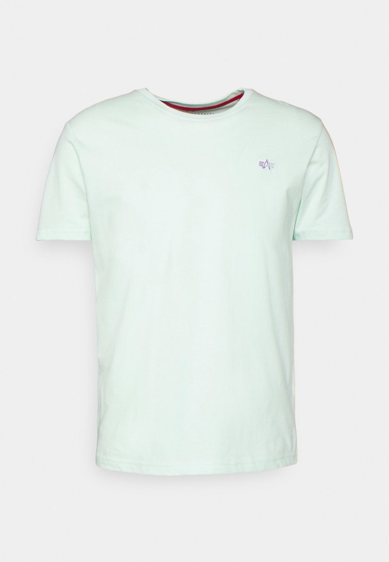 Helles mintgrünes T-Shirt aus weicher Baumwolle mit Rundhalsausschnitt, kurzen Ärmeln und einem kleinen lila Logodetail auf der Brust.