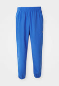 Blaue Sporthosen mit elastischem Bund, geradem Bein und schmal zulaufenden Säumen. Mit dem goldenen Nike-Logo auf der linken Seite.