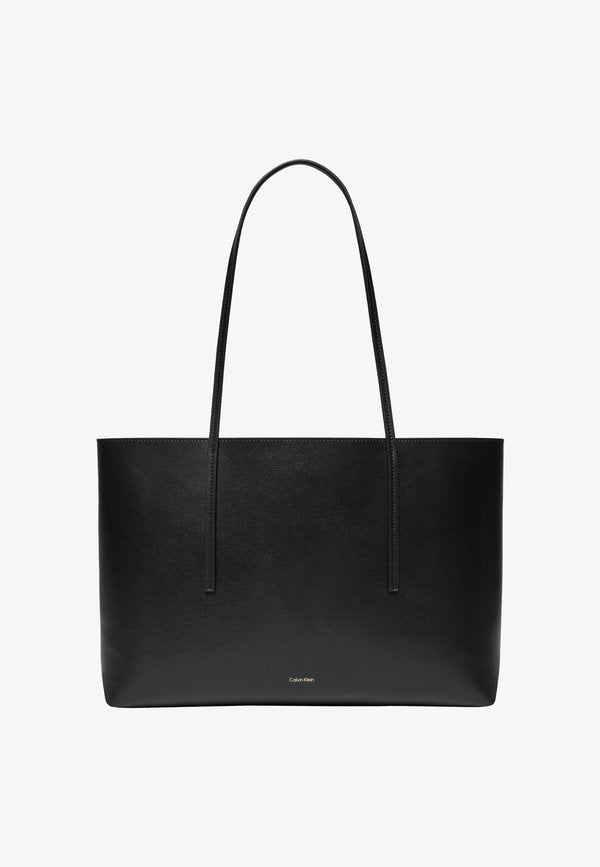 Calvin Klein FOIL LOGO TOTE POUCH - Tote bag - black/toasted coconut