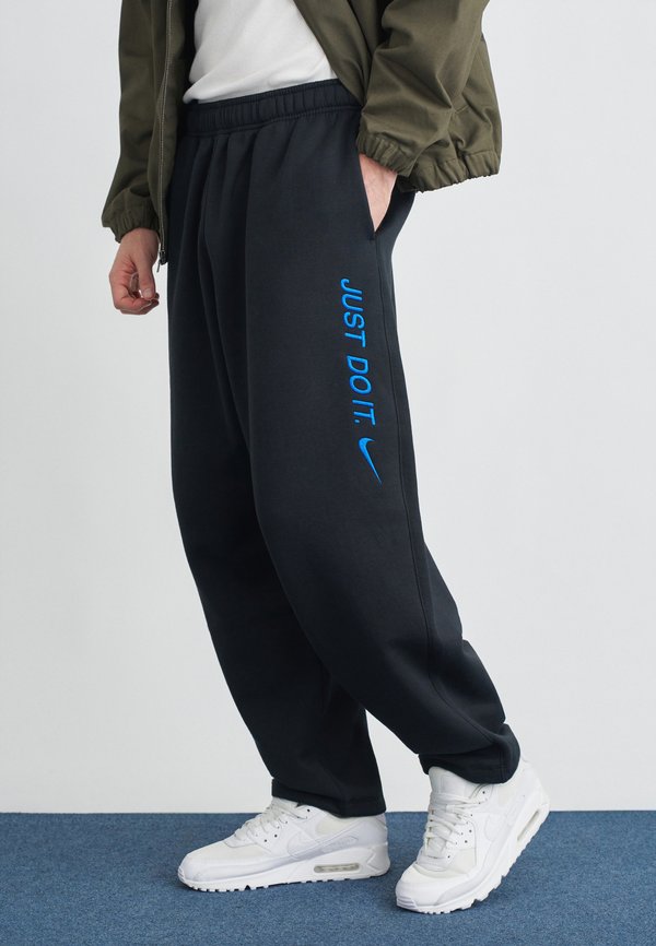 Nike Sportswear Tracksuit bottoms - black/game royal
