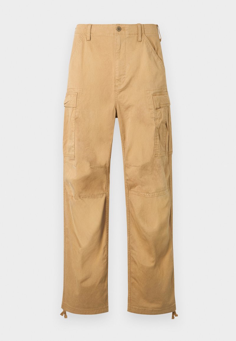 Beige Cargohosen mit seitlichen Klappentaschen, Knopfverschluss, Gürtelschlaufen und verstellbaren Kordeln am Saum.