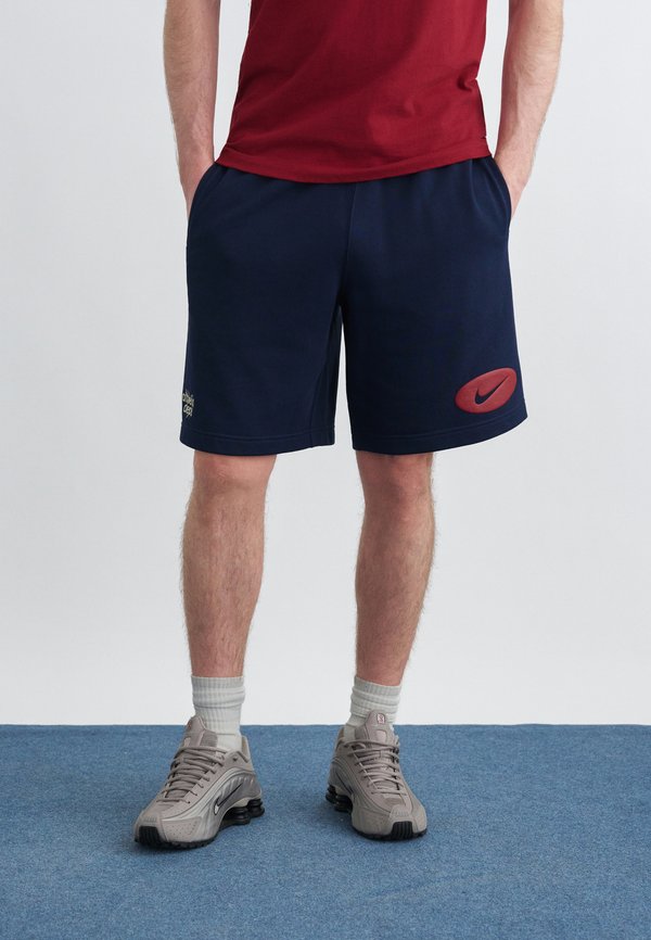 Nike Sportswear CLUB REISSUE - Tracksuit bottoms - obsidian/khaki