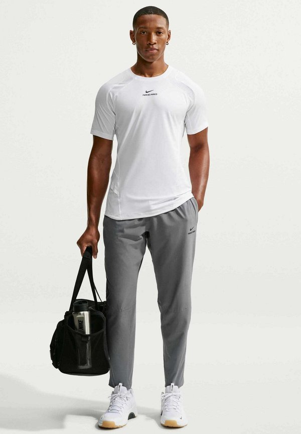Nike Performance M NP DF NPT PANT - Tracksuit bottoms - smoke grey black