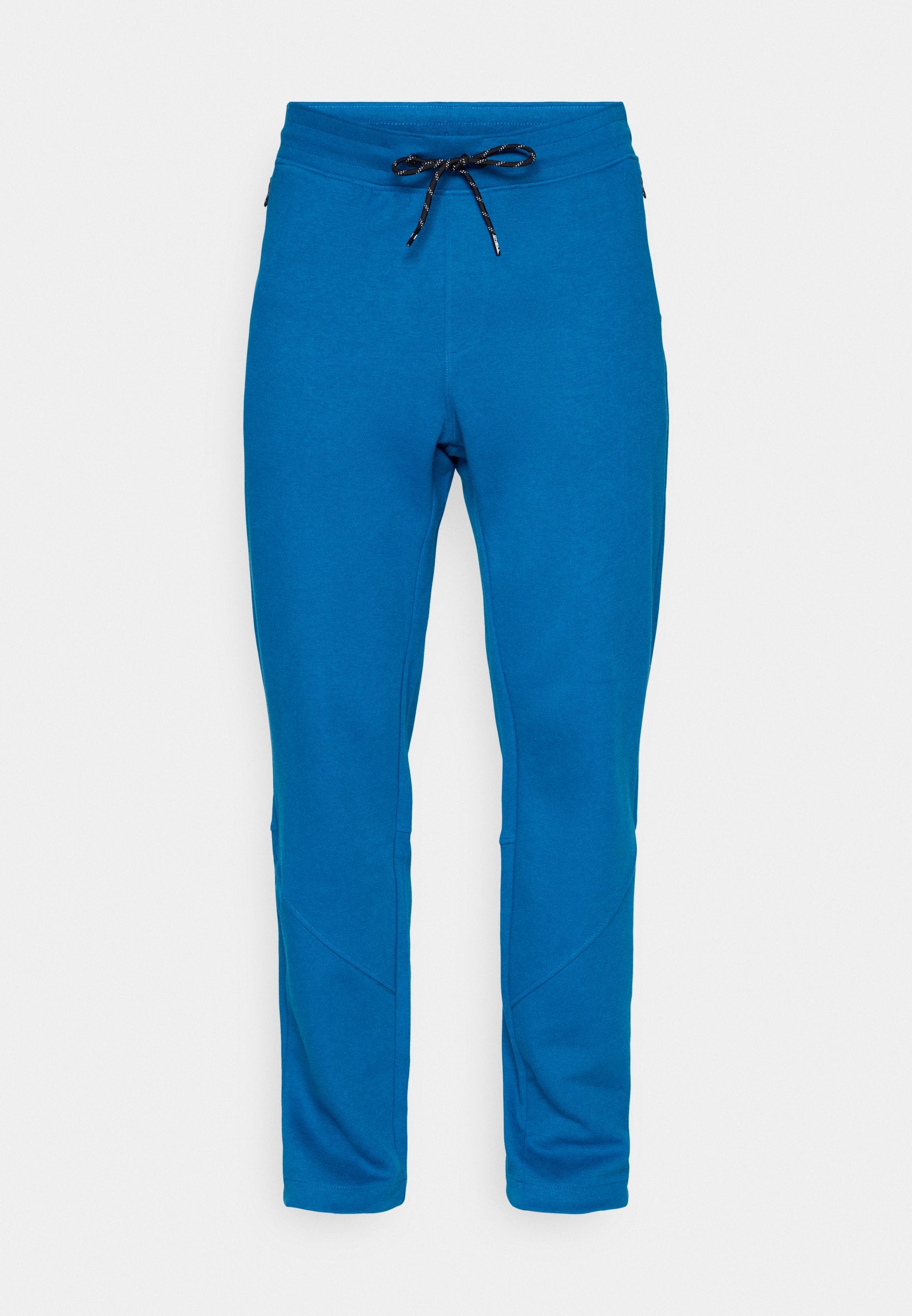 Blaue Slim-Fit-Sweatpants mit schwarzem und weißem Kordelzug, schmal zulaufenden Beinen und sichtbaren Nähten an den Knien.