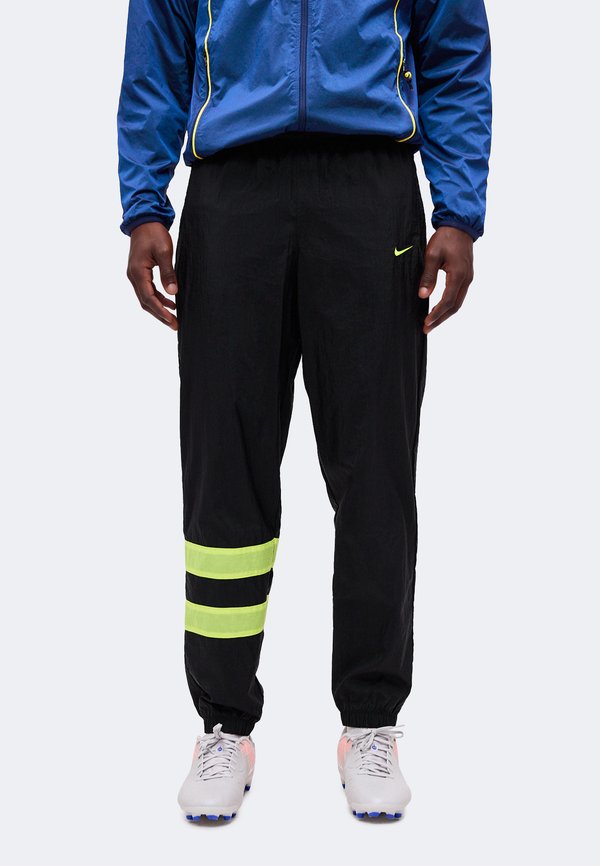 Nike Performance Tracksuit bottoms - black/lemon