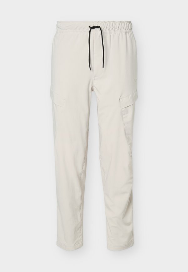 Nike Performance CARGO - Tracksuit bottoms - light orewood/black