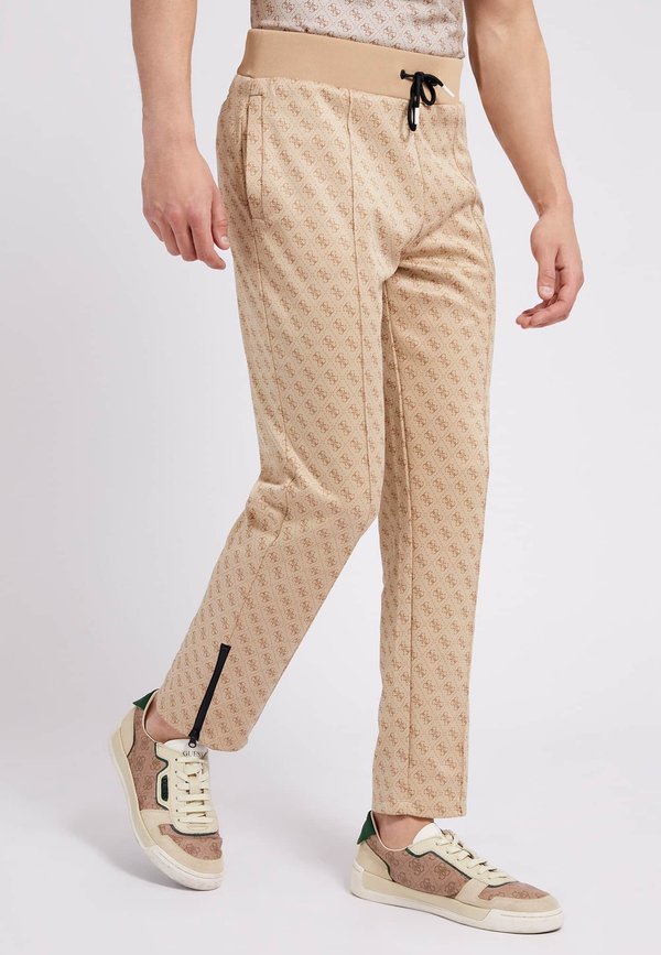 Guess ALLOVER LOGO - Tracksuit bottoms - beige
