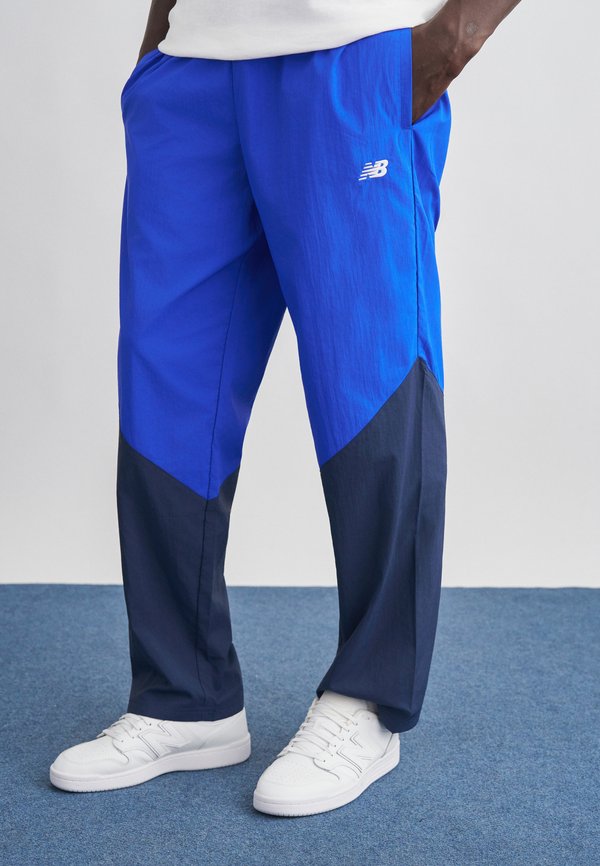New Balance SPORT LEGACY PANT - Tracksuit bottoms - navy/galaxy blue