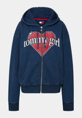 Navyblaue Reißverschlussjacke aus Baumwollmischgewebe, mit einem roten Herzgrafik und dem Text "tommy girl" sowie einem Sternmotiv auf der Vorderseite.