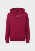 Roter Hoodie aus Baumwolle mit Kängurutasche vorne, verstellbarer Kapuze mit Kordelzug und weißem Logo-Schriftzug "TOMMY JEANS" auf der Brust.