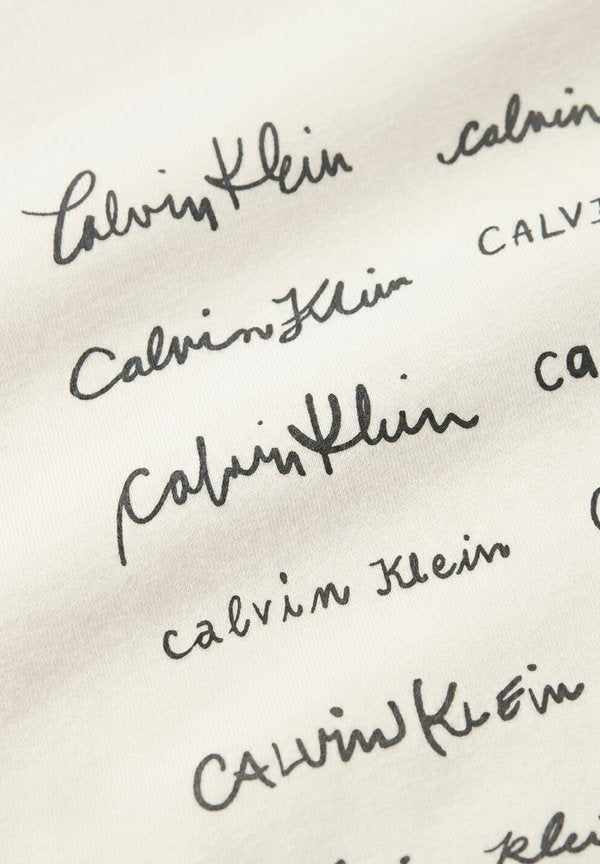 Calvin Klein CALVIN KLEIN DAMES T-SHIRTS SS CROPPED BOXY GRAPHIC TEE.