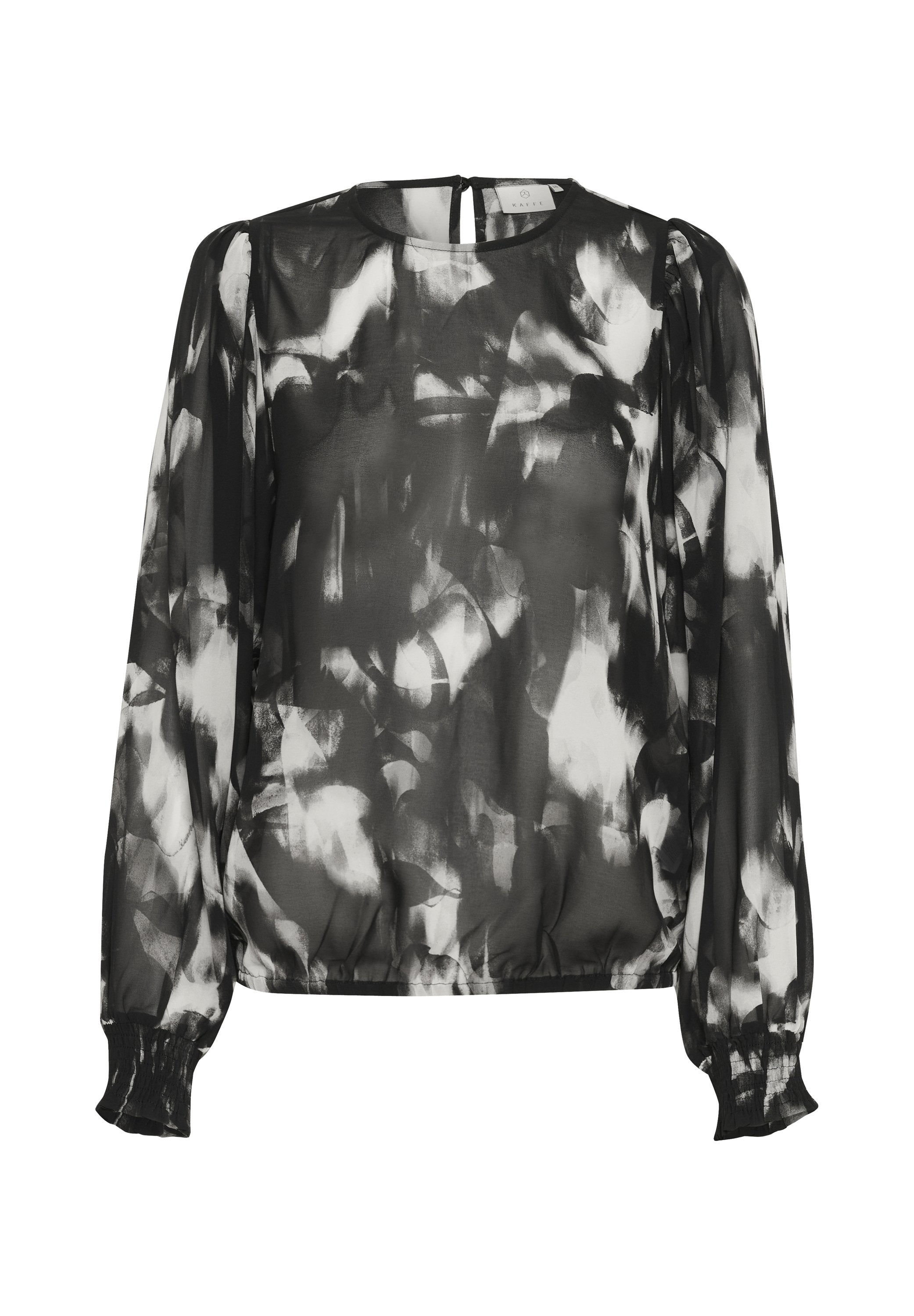 Schwarze und weiße transparente Bluse mit abstraktem Muster, langen Ärmeln, rundem Halsausschnitt, elastischen Bündchen und einer leichten Raffung am Saum.