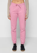 Helle rosa Jogginghosen mit elastischem Bund und Kordelzug. Sie verfügen über elastische Bündchen an den Knöcheln und eine weiche, glatte Textur.