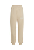 Beige Jogginghose mit elastischem Bund und Bündchen, mit weißem Text "The Future Surf Society" auf dem oberen linken Oberschenkel.