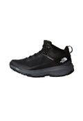 Schwarze Wanderschuhe mit einem Mesh-Obermaterial, Gummisohlen, gepolsterten Zwischensohlen und einer Schlaufe am Fersenbereich für ein einfaches Anziehen.