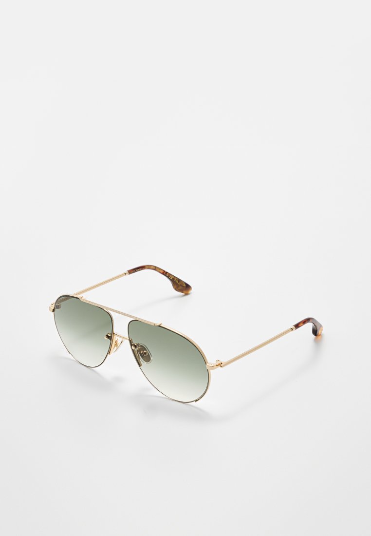 Goldene Metall-Fliegerbrille mit grünem Verlaufsglas und einem Schildpattmuster an den Bügelspitzen. Verstellbare Nasenpads für zusätzlichen Komfort.