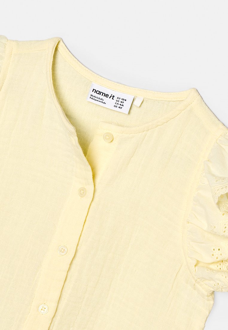 Name it NMFPHAKKI CAPSL SHIRT