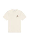 Cremefarbenes T-Shirt mit kurzen Ärmeln und Rundhalsausschnitt, mit einem kleinen aufgedruckten Design eines Schlüssels und eines Motel-Schlüsselanhängers auf der linken Brust.