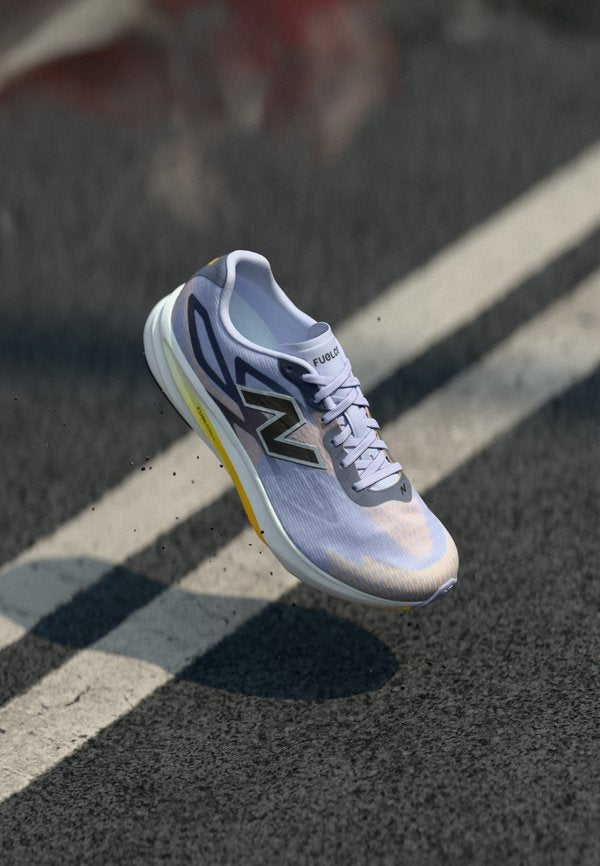 New Balance FUELCELL FLITE - Road running shoes - smoked violet/satsuma orange/meteorite