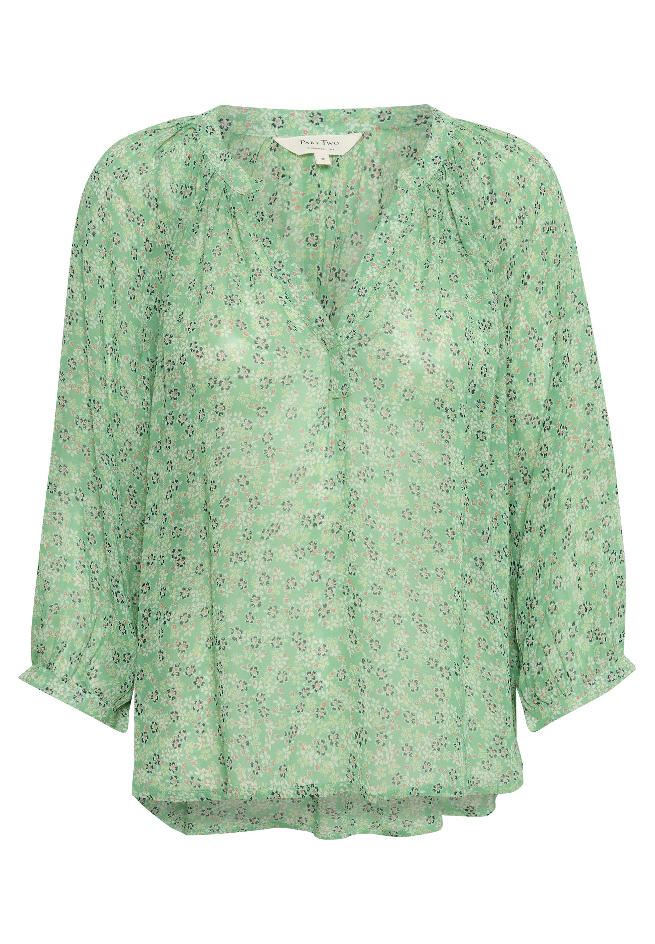 Grüne Bluse mit floralem Muster aus transparentem Stoff, mit V-Ausschnitt, Dreiviertelärmeln und lockerem Schnitt mit Raffung.
