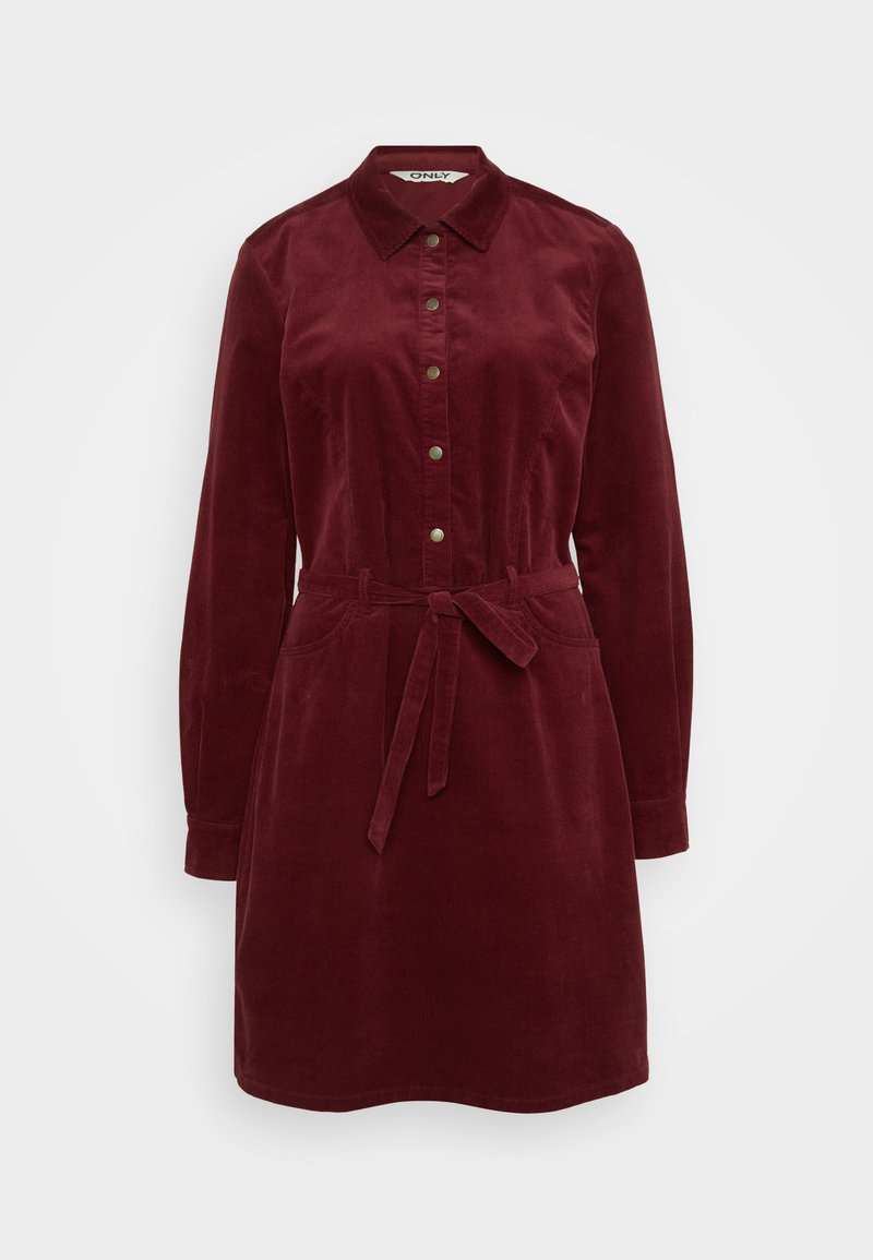 Kord Hemdkleid in tiefrot, mit Kragen, frontalen Knöpfen, langen Ärmeln, einem Taillengürtel und zwei Seitentaschen. Weiche Textur.