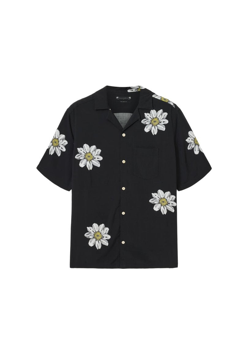 Schwarzes Kurzarmhemd mit weißer und gelber Blumenstickerei, ausgestattet mit einer Tasche und einer durchgehenden Knopfleiste. Glatte Stoffstruktur.