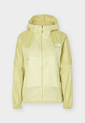 Hellgelbe Windjacke mit durchgehendem Reißverschluss, Kapuze, langen Ärmeln, zwei vorderen Reißverschlusstaschen und dem The North Face-Logo auf der linken Brust.