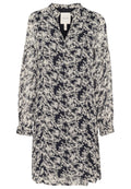 Navyblaues Blumen-Kleid aus leichtem Stoff, mit langen Puffärmeln, einem V-Ausschnitt und einer lockeren Passform, das mit einem weißen Blumenmuster überzogen ist.
