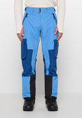 Blaue Skihose in verschiedenen Blautönen, mit Cargo-Taschen, Reißverschlüssen und einem strukturierten schwarzen Einsatz an den Knöcheln.