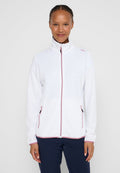 Weiße Fleecejacke mit Reißverschluss und Stehkragen. Verfügt über rosa Akzente, Seitentaschen, eine strukturierte Oberfläche und gerippte Bündchen.