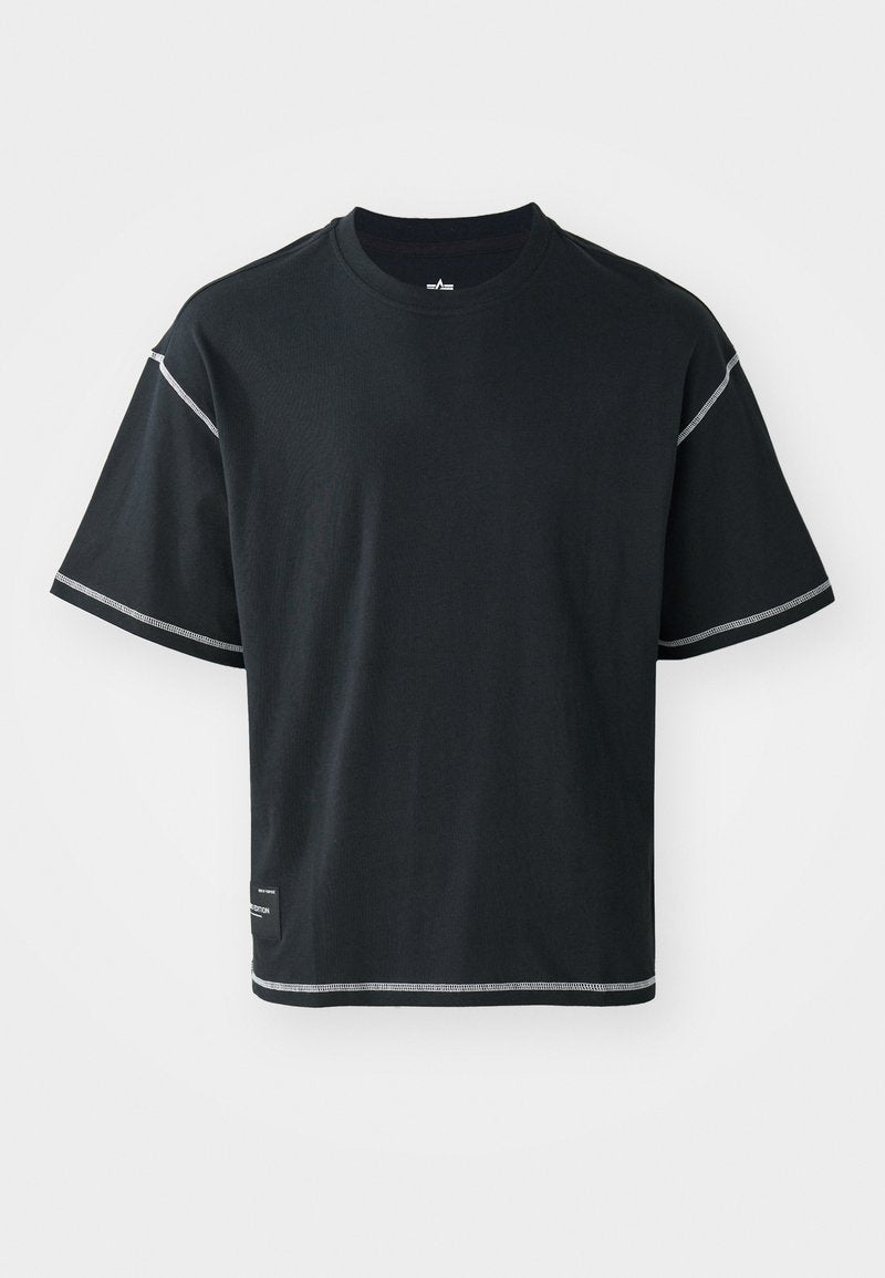 Schwarzes T-Shirt in lockerer Passform, aus Baumwolle. Mit kurzen Ärmeln, rundem Ausschnitt und kontrastierendem weißen Nähten entlang der Schultern und dem Saum.