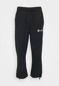 Schwarze Jogginghosen aus weichem Stoff, mit elastischem Bund und Kordelzug, sowie einem kleinen gestickten Design am Oberschenkel.