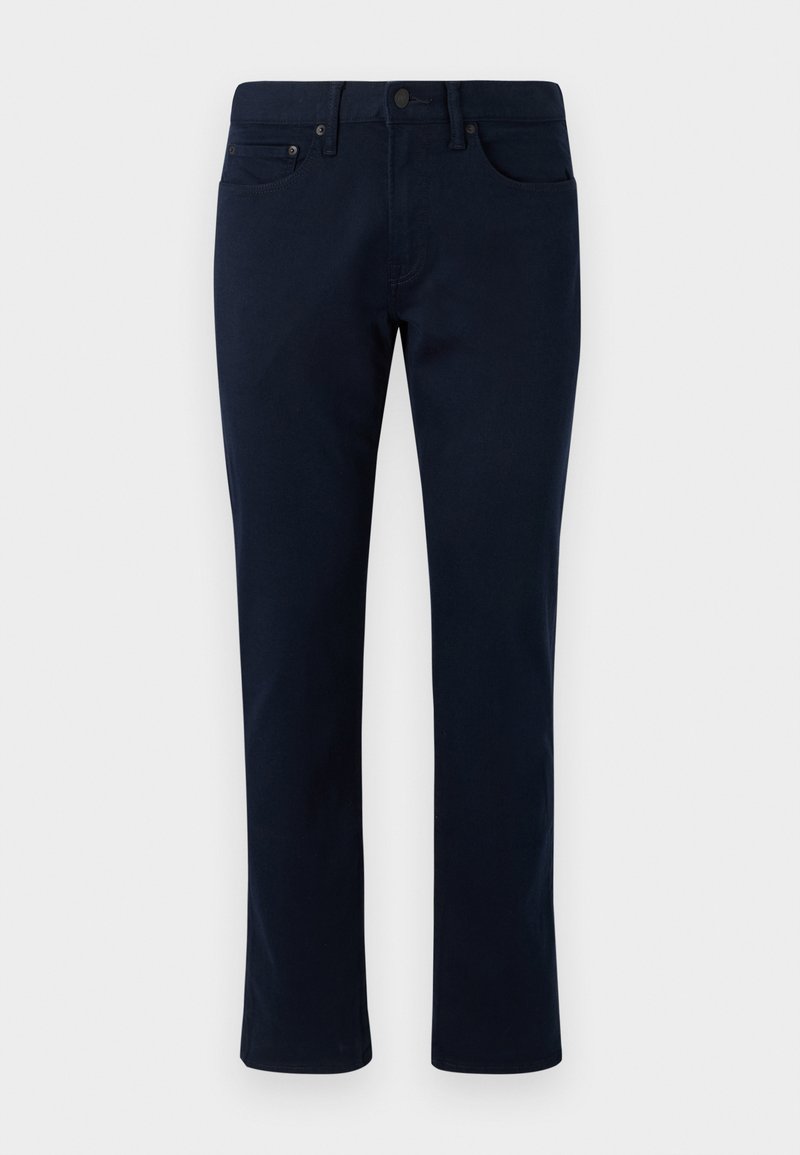 Marineblaue Jeanshose mit slim-fit-Schnitt, ausgestattet mit einem klassischen Fünf-Taschen-Design und dezenten Nähakzenten. Glatte Textur ohne Verzierungen.