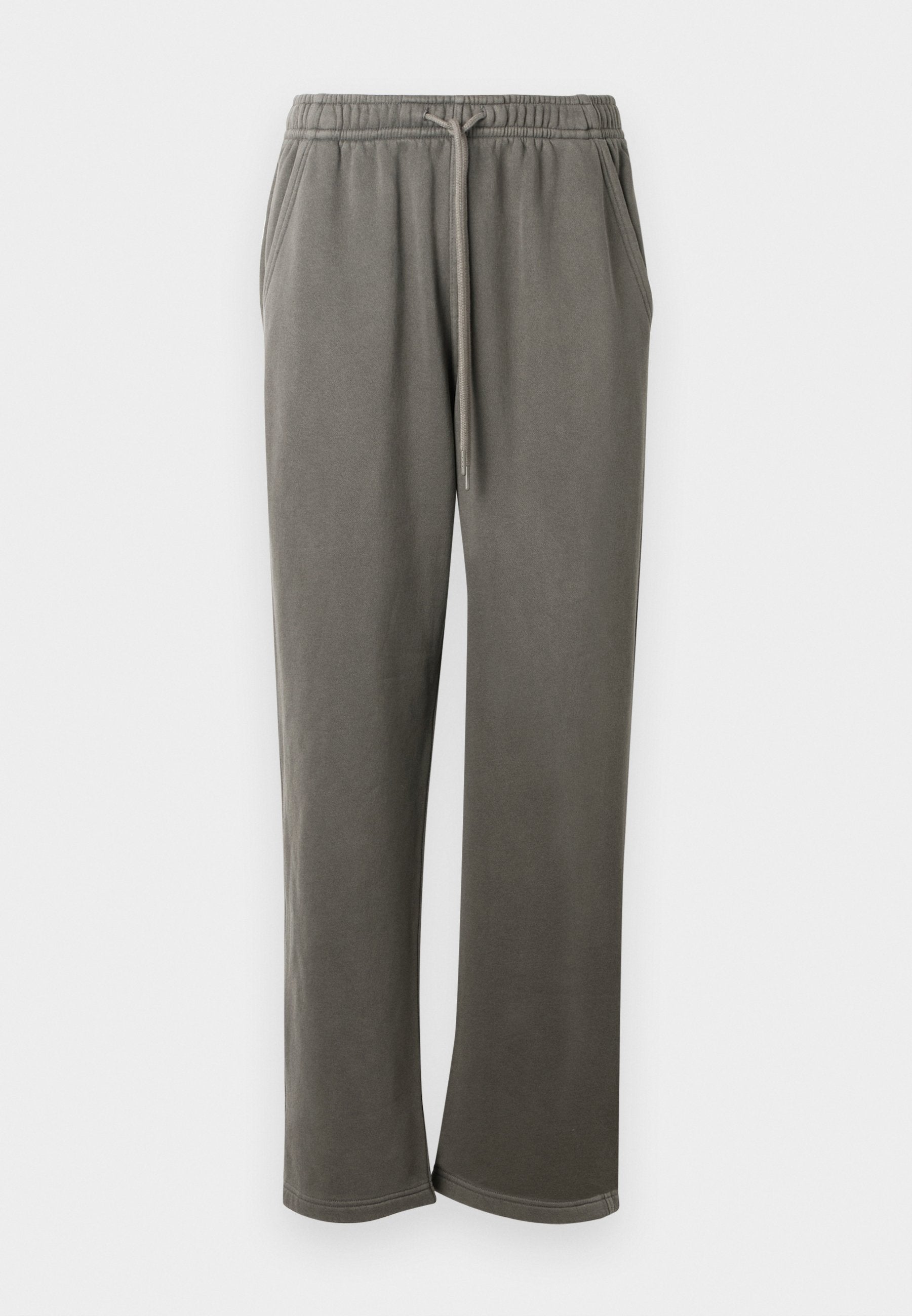 Graue Baumwoll-Sweatpants mit elastischem Bund und Kordelzug, seitlichen Taschen und einer lockeren Passform über die Beine.