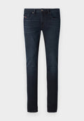 Dunkelblaue Slim-Fit-Jeans mit leichtem Verblassen an den Oberschenkeln, Fronttaschen, Gürtelschlaufen und Knopfverschluss an der Taille.