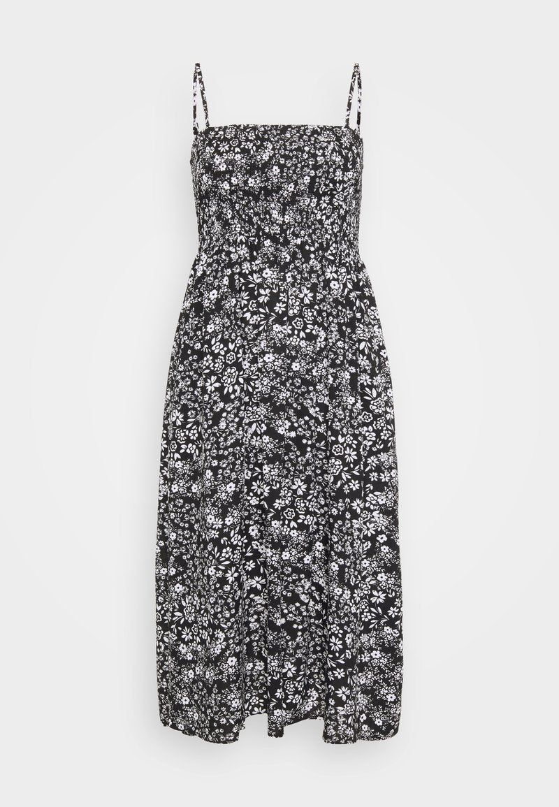 Schwarzes florales Midikleid mit figurbetontem Oberteil, verstellbaren Spaghettiträgern und einem gerafften Taillenbereich. Der Stoff hat eine weiche, leichtgewichtige Textur.