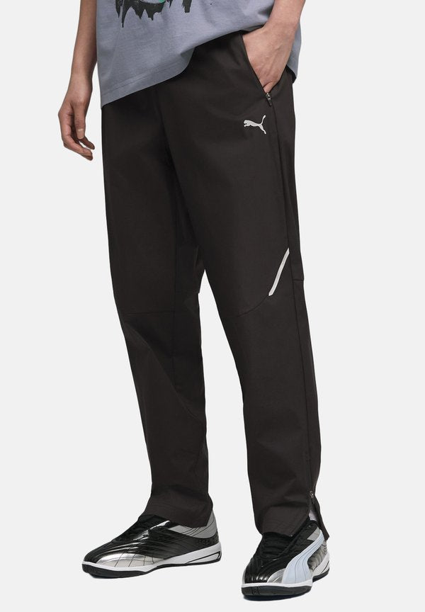 Puma TECH TRAININGS - Tracksuit bottoms - black