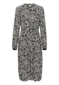 Langärmliges Kleid mit einem Schwarz-Weiß-Blattmuster. Verfügt über eine durchgehende Knopfleiste, einen elastischen Bund und geknöpfte Ärmel. Hergestellt aus leichtem Material.