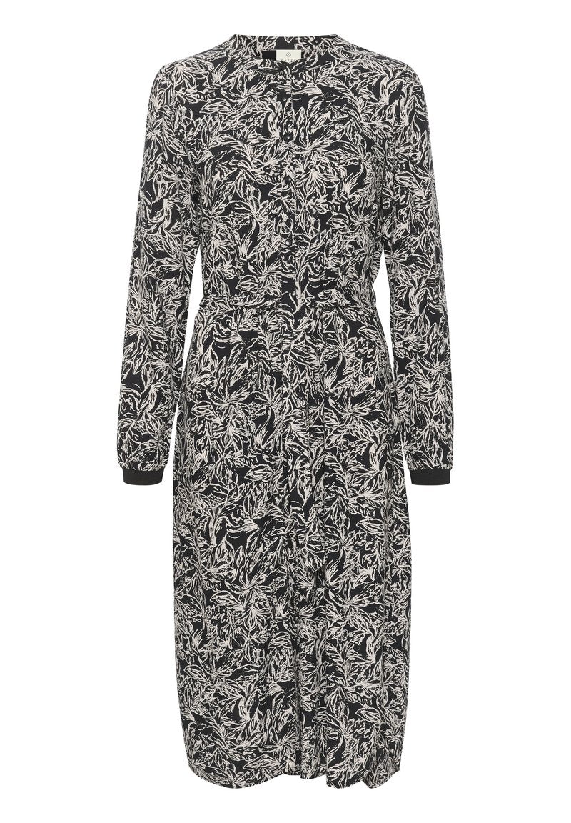 Langärmliges Kleid mit einem Schwarz-Weiß-Blattmuster. Verfügt über eine durchgehende Knopfleiste, einen elastischen Bund und geknöpfte Ärmel. Hergestellt aus leichtem Material.