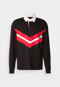 Schwarzes Rugby-Shirt mit langen Ärmeln, weißem Kragen, rotem und weißem Zickzackstreifen über die Brust und gesticktem Patch auf der linken Seite.