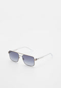Sonnenbrille mit Metallrahmen, rechteckigen blauen Verlaufsgläsern und transparenten Kunststoffbügeln, liegend auf einer weißen Oberfläche.