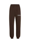 Dunkelbraune Sweatpants mit elastischem Bund und Bündchen, mit weißem Text "The Future Surf Society" auf dem oberen linken Oberschenkel.