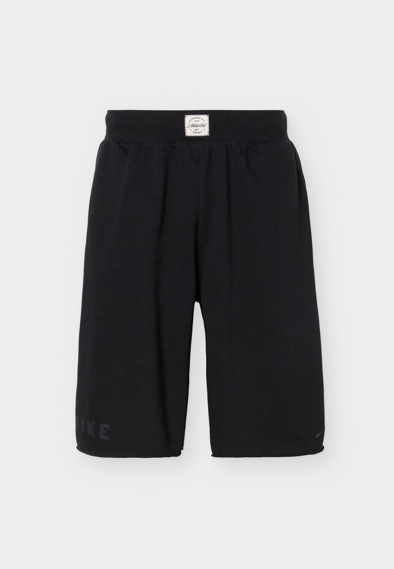 Schwarze kniehohe Sportshorts mit elastischem Bund und kleinem weißem Etikett mittig vorne oben.