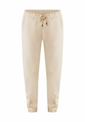 Beige Jogginghosen aus weichem Stoff, mit einem elastischen Bund und einer Kordel sowie Druckknopfakzenten an den Knöcheln.