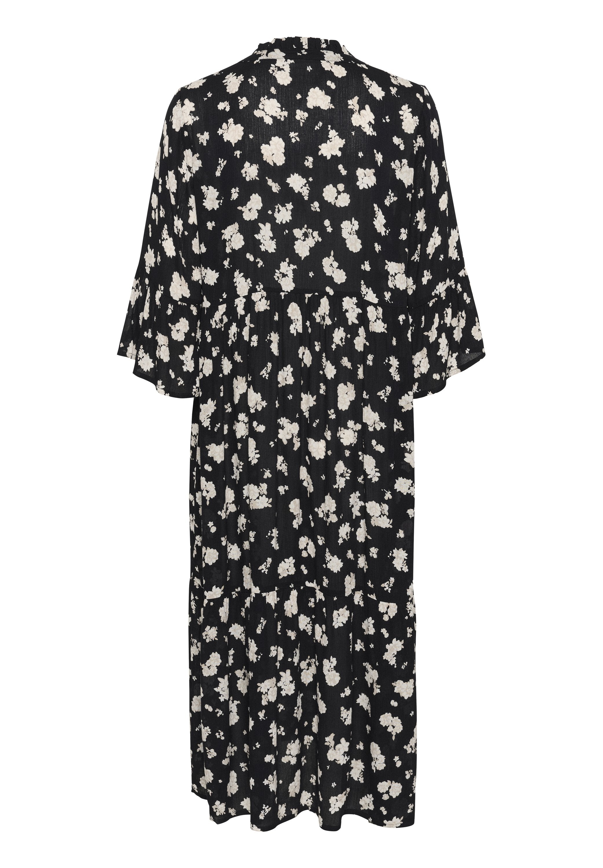 Schwarz-weißer Blumenmuster-Kleid. Mit kurzen, glockenförmigen Ärmeln und einem gefältelten Design, knielang, aus leichtem Stoff.
