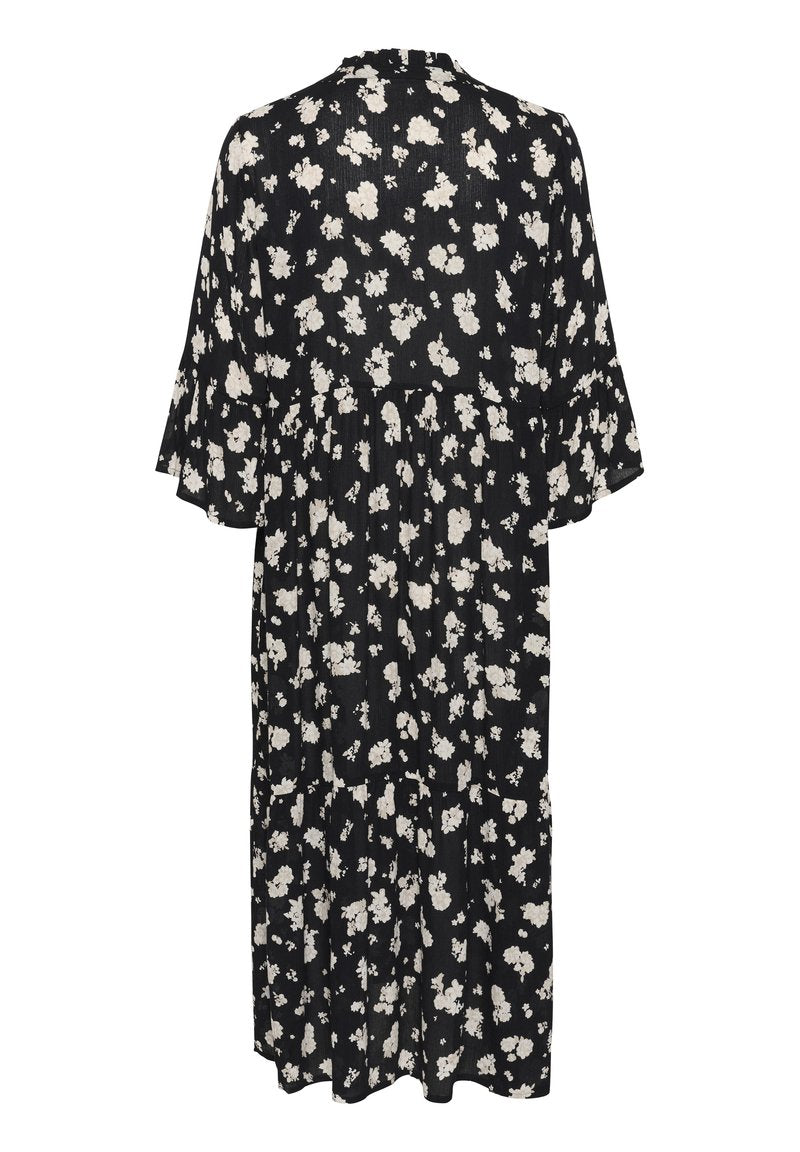 Schwarz-weißer Blumenmuster-Kleid. Mit kurzen, glockenförmigen Ärmeln und einem gefältelten Design, knielang, aus leichtem Stoff.