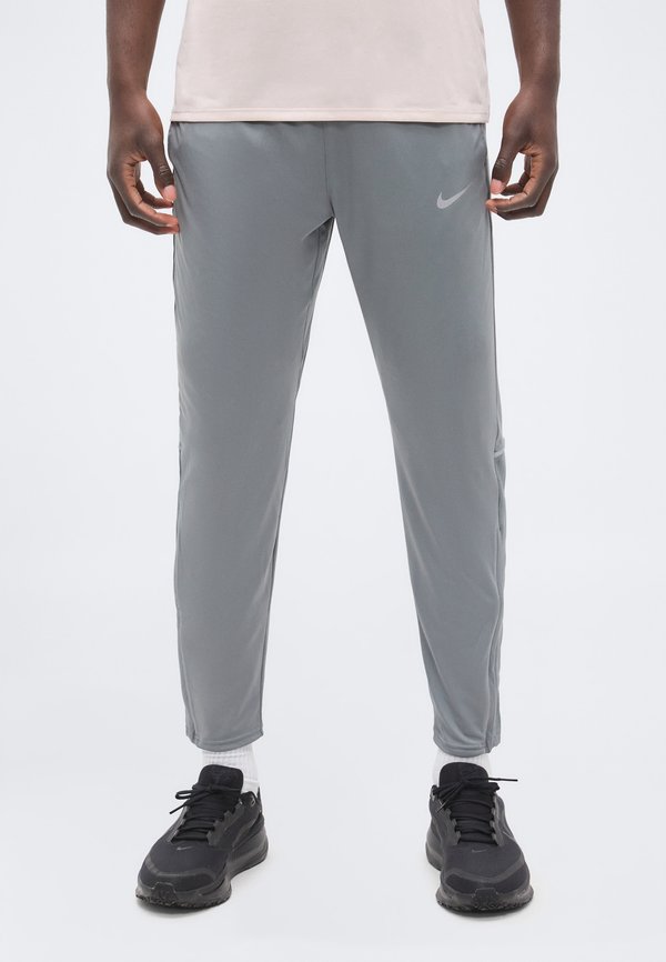 Nike Performance MILER - Tracksuit bottoms - smoke grey