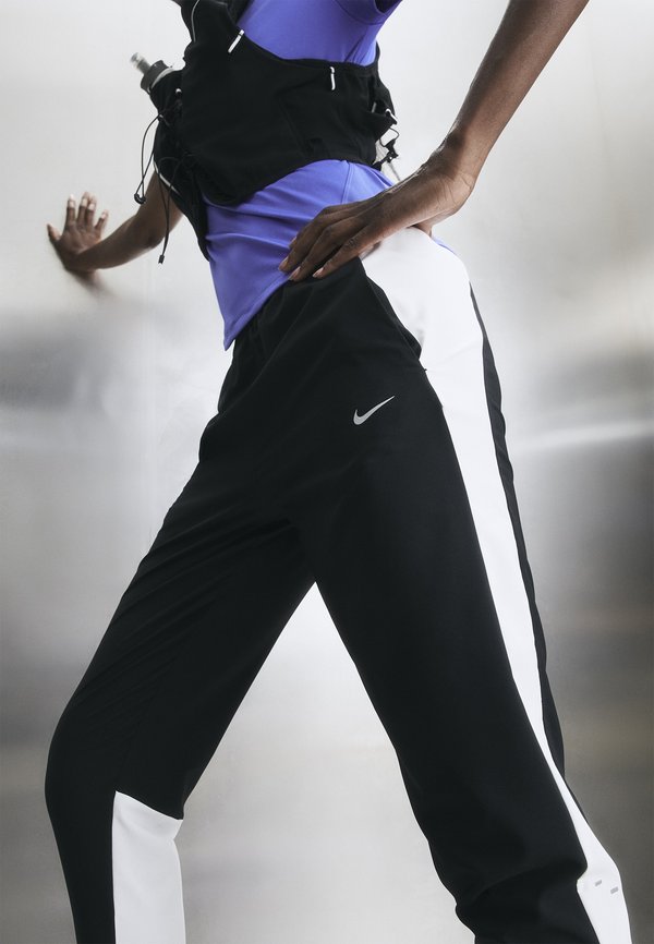 Nike Performance TEMPO - Tracksuit bottoms - black/white